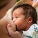 Breastfeeding a newborn baby child. Moscow, Russia.
