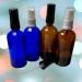 2 blue and 2 amber bottles with atomizers