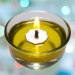 Floating wick lit in a glass jar