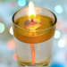 Floating wick lit in a glass jar
