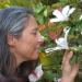 Kim smelling flowers at Hawea Pl Olinda, Maui, Hawaii