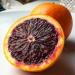 Citrus × sinensis, half of an orange cut in half with a sharp knife and a full, 