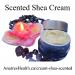 A jar and a lit tealight in a flower candle holder showing Scented Shea Cream A jar and a lit tealight in a flower candle holder showing Scented Shea Cream