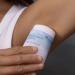 Applying a stick deodorant to an armpit closeup