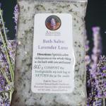 Lavender bath salts bag with flowers in the background