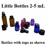 A variety of little bottles with their tops.