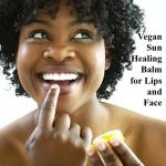 A happy woman applies Vegan Sun Healing Balm for Lips and Face by Anarres