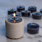 Candle: Beeswax Tealight With Cup in Black in containers