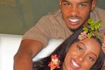 man_and_woman_smiling_on_bed-scopio-4x6