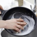 Walnut Sponge Pads by Full Circle scrubbing a pot